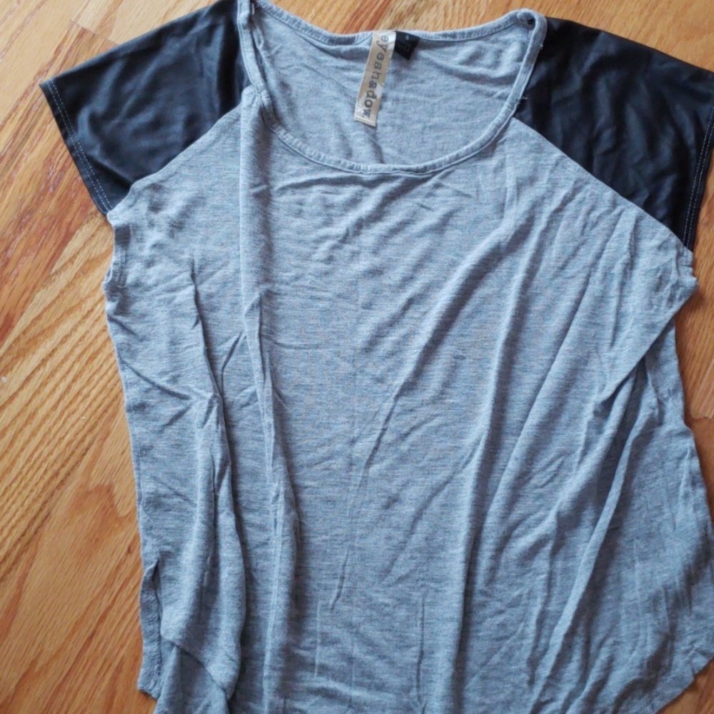 Grey shirt with leather like material on the sleev